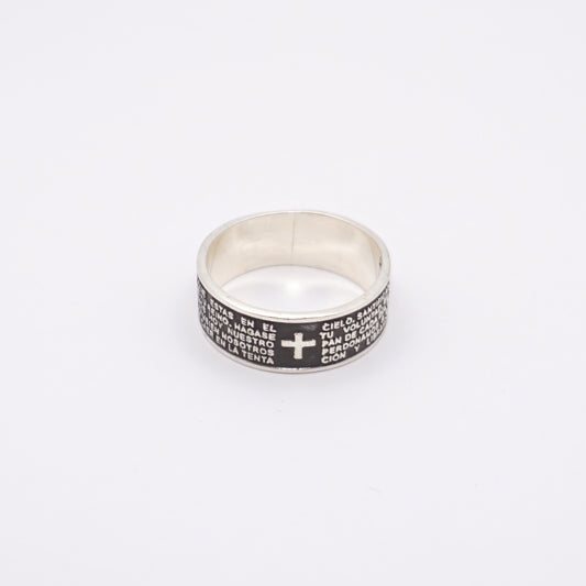 Bague en argent massif de la boutique Altiplano, ornée d'une croix et de gravures en espagnol.
